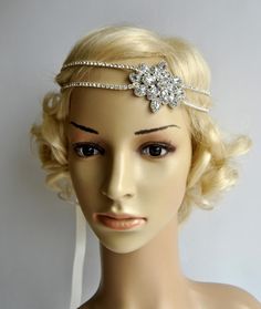 Ready to ship Stunning Clear Rhinestone Crystal Silver 1920s headpiece - flapper headband. Beautiful sparkling bridal , The Great Gatsby party or any special occasion rhinestone headpiece Can be worn many different styles. Made of - stunning clear rhinestone crystal silver headband - four lines of the rhinestone trim - embellished with large gorgeous sparking Art Deco rhinestone brooch - tie on with satin ribbons Each feather fascinator is handmade so every is different and unique! Simply adorab Flapper Hats, The Great Gatsby Party, Oud Hollywood, Wedding Gatsby, 20s Wedding, Flapper Headpiece, Gatsby Headband, 1920s Headpiece, Wedding Headpieces