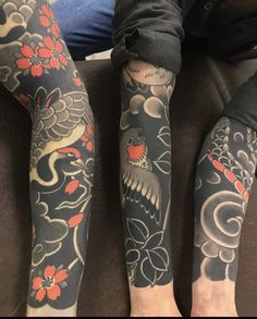 two people with tattoos on their arms and legs, both have red flowers on them