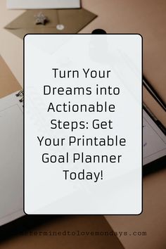 a notepad with the words turn your dreams into actionable steps get your printable goal planner today