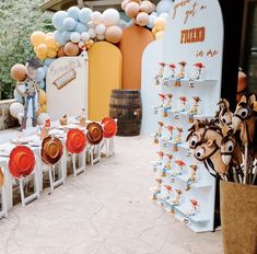 there are many decorations on the table for this birthday party that is ready to be eaten