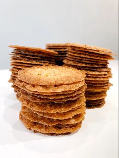 a stack of crackers sitting on top of a white table next to each other