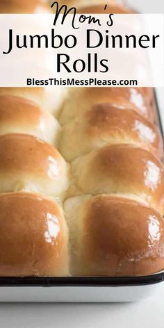 a loaf of bread sitting on top of a pan with the words mom's jumbo dinner rolls