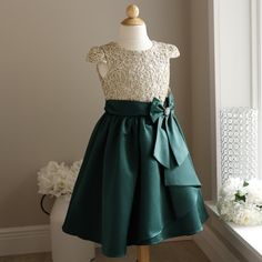 This Girl's Formal Dress Is Stunning!!! Your Girl Will Look Like Nothing Less Than Royalty In This Piece! The Dress Is Done Is A Beautiful Deep Emerald/Hunter Green Satin Matte With A Gorgeous Golden Accented Bodice. The Top Is Done In A Gorgeous Filagree Design Done In Metallic Gold. A Bodice And Arms Have A Liner Done In An Ivory Champagne, And Sits Behind The Filagree Design For Modesty. Cap Sleeves Add Elegance To The Dress. The Waist Is Adorned With A Matching Sash With A Pre-Tied Bow Which Filagree Design, Gold Formal Dress, Party Portrait, Bow Sash, Girls Formal Dresses, Bridesmaid Flowers, Junior Bridesmaid, Your Girl, Green Satin