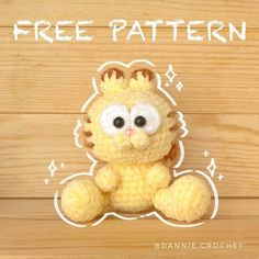 a crocheted yellow stuffed animal sitting on top of a wooden floor with the words free pattern above it