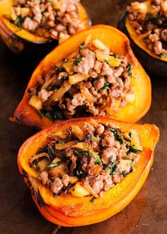 three stuffed pumpkins filled with meat and vegetables