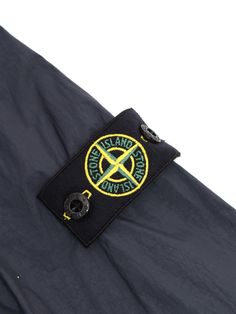 Stone Island blue jacket for children without hood, high collar, two slanted pockets on the front, logo plate on the sleeve.Composition: 100% Polyamide Fabric 2 100% Cotton Fabric 3 100% Polyamide Winter Long Sleeve Outerwear With Logo, Blue Long Sleeve Outerwear With Logo Patch, Long Sleeve Outdoor Outerwear With Logo Patch, Long Sleeve Outerwear With Logo Patch For Outdoor, Blue Winter Outerwear With Logo Patch, Stone Island Kids, Stone Island Junior, Island Blue, Zegna Shoes