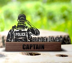 a wooden sign that says police brayden james captain