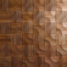 a wooden wall with many squares and lines on the surface, as if it were made from wood