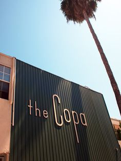 there is a large sign on the side of this building that says the copa