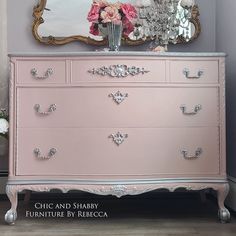 a pink dresser with flowers on top and a mirror above it that says chic and shabby furniture by recca