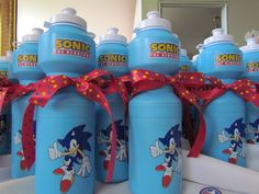 several blue sonic water bottles with red bows on them