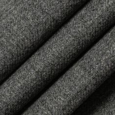 the fabric is dark grey and it looks like wool