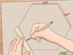 two hands are drawing on a piece of paper with pencils and ruler next to it