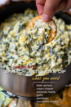 spinach artichoke dip in a skillet with a spoon scooping out