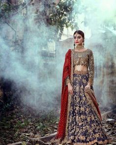 Traditional Navy blue and Red Indian bridal wear, heavily embellished outfit with zari gold kora pearls, dapka, and stones work. Paired with beautiful blue chiffon lehnga enhanced with cutwork and Deep red embroidered chiffon dupatta with heavy borders on all sides that make your look more traditional. For More Details Call / Whatsapp Us Now: +1-732-910-5427 Why NameerabyFarooq: %100 Accurate Measurement & Fitting. (Please Ask Us Your exact measurement) All Dresses are Manufactured designs/C Traditional Dresses Indian, Maroon Lehenga, Pakistani Traditional, Chic Prom Dresses, Nikah Dress, Embellished Clothing, Red Lehenga, Indian Bridal Dress, Indian Bridal Wear