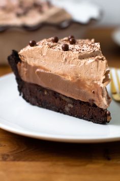 a piece of chocolate cake on a white plate