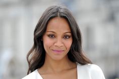 a close up of a person wearing a white shirt