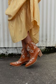 Whether you're two - stepping on the dance floor or strolling through the city streets, the Dolly Embroidered Cowboy Boot is the perfect addition to your boho wardrobe because they features: Man - made faux leather material Classic cowboy boot design So cute embroidery details throughout Rounded toe for comfort and style Block wooden heel *Due to lighting and differences in monitors, actual colors may vary slightly from what appears online. Approximate measurements are as follows: Fits True To S Boho Wardrobe, Boho Essentials, Classic Cowboy, Boot Design, Bralette Outfit, On The Dance Floor, Cute Embroidery, Wooden Heel, Cowboy Boot