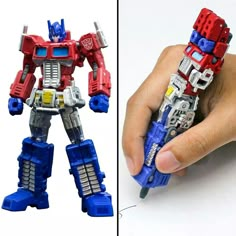 a hand is holding a toy that looks like a robot from the movie opttron