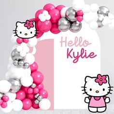 a hello kitty balloon arch with balloons