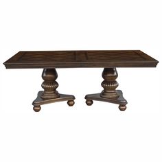 a wooden table with two pedestals on each side