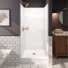 a bathroom with gray walls and white tile on the floor, along with a walk in shower