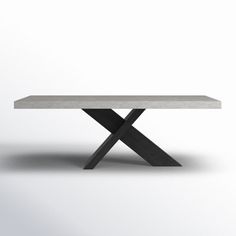 a white table sitting on top of a wooden cross legged base in front of a gray background