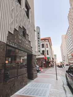 a city street with cars parked on the side of it