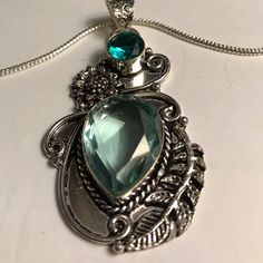 Stunning 925 Sterling Silver Aquamarine Aqua Apatite Necklace. 20 Inches N Chain Length. 2.5 Inches N Pendant Length. 30 Carats Of Aquamarine Stones. 2 Carats Of Aqua Apatite Stones. 100% Authentic Stones, 925 Sterling Silver. This Will Be A Nice Addition To Your Jewelry Collection. Thanks For Dropping In An Checking My Closet Out. God Has Blessed Me With Such Wonderful People In My Life. I’m So Appreciate Everyone Of You. “Hugs” May Gods Light Shine Upon All Of You. Silver Jewelry With Gemstone Accents For May Birthstone, Silver Green Amethyst Gemstones For Gift, Spiritual Silver Jewelry With Blue Topaz, Handmade Silver Jewelry With Green Amethyst, Silver Jewelry With Green Amethyst For Gift, Ruby Diamond Necklace, Apatite Necklace, Aquamarine Necklace, Aquamarine Jewelry