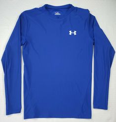 This is an Under Armour men's long sleeve heat gear shirt, size Extra Large / XL.  The color is blue, and the material is a lightweight and comfortable polyester & elastane blend.  The shirt is a normal UA stretchy/compression/tight shirt that helps you to look your best. Please see the photos for detailed views. I welcome any questions, and thank you for looking and possibly buying. Casual Blue Top By Under Armour, Blue Casual Top By Under Armour, Casual Blue Under Armour Top, Under Armor Compression Shirt, Mens Long Sleeve Under Armour Shirts, Casual Blue Under Armour T-shirt, Under Armour Crew Neck T-shirt For Streetwear, Unrealistic Wishlist, Blue Short Sleeve Under Armour T-shirt