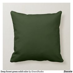 a green pillow with the word hunter green by sproulddesigns on it