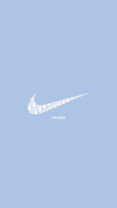 a white nike logo on a blue background