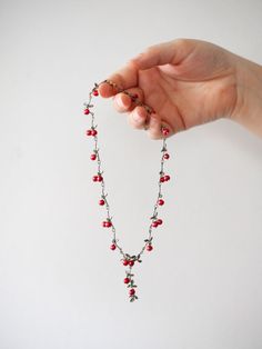 Cranberries are a symbol of abundance and gratitude. They are a beautiful part of the holiday season. Named for the cranes that love to eat them, these beautiful berries are jolly and bright and make the season feel right. - DETAILS - Measurements: Necklace: 16” adjustable necklace Hoop Earrings: 1.5" dangle Made of cast bronze with a hand patina finish and accented with cranberry freshwater pearls. Made in the U.S.A. Fruit Jewelry, Heirlooms Jewelry, Harvest Decorations, Pearls Necklace, Patina Finish, Brass Jewelry, Christmas Jewelry, Adjustable Necklace, Christmas Gifts For Her