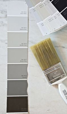 the paint swatches are being used to match the colors on the wall and floor