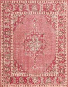 an old rug with red and beige colors