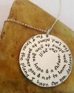 "DESCRIPTION: Bible Verse Scripture Extra Large 1 1/2\"Sterling Silver Round Jeremiah 29:11 Custom Hand Stamped Metal Necklace. This 1 1/2\" Solid Sterling Silver necklace is shown Polished on a Rolo chain in image one and with an Aged Finish on a Leather Chain in image two. You choose the finish and chain type and length. When choosing the chain, the + cloth option adds a polishing cloth for $3. The Bible Verse Scripture featured on this piece is Jeremiah 29:11, however any scripture or wording Bible Verse Necklace, Hand Stamped Metal, Stamped Metal, Jeremiah 29, Metal Necklace, Copper And Brass, Jewelry Outfit, Birthstone Charms, Rolo Chain