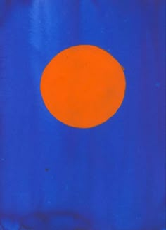 an orange circle on a blue background is seen in this image, it appears to be painted with acrylic paint