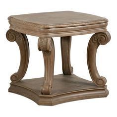 a wooden table with an ornate design on it's top and bottom shelf, sitting against a white background