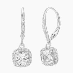 Step into elegance with our exquisite Sterling Silver Cushion Cut Leverback Earrings, featuring a mesmerizing cushion cut clear CZ center stone, surrounded by a halo of sparkling clear cubic zirconia stones. The cushion cut style adds a touch of sophistication and timeless beauty to these earrings, and the secure Leverback closure ensures a comfortable fit. Perfect for any occasion, these earrings will make a statement and elevate your style to the next level. Cushion Cut Cubic Zirconia Jewelry With Pave Setting, Elegant Cushion Cut Cubic Zirconia Earrings, Cushion Cut Diamond Earrings For Wedding, Wedding Cushion Cut Diamond Earrings, Square Cut Cubic Zirconia Earrings With Diamond Accents, Elegant Square Cut Jewelry With Pave Setting, Square Cut Cubic Zirconia Earrings For Wedding, Square Cut Cubic Zirconia Wedding Earrings, Elegant Square Cut Pave Setting Jewelry