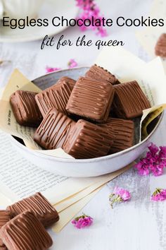 eggless chocolate cookies in a bowl on a table with pink flowers and napkins