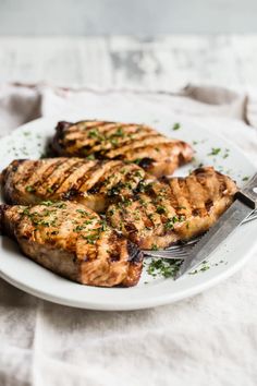 Succulent grilled pork chops make a perfect dinner, any night of the week. A super simple marinade that you throw together with common pantry ingredients does all the work for you; all you have to do is fire up the grill and make a salad. Hearty Pasta Recipes, Pork Chop Recipes Grilled, Simple Marinade, Make A Salad, Bacon Wrapped Pork Tenderloin, Bacon Wrapped Pork, Grilled Pork Chops, Veggie Pizza