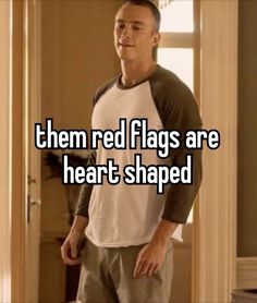 a man standing in front of a door with the words, then red flags are heart shaped