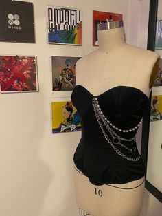 KPOP - ATEEZ Corset - Dark Versions/Say My Name.  For casual fandom wear on the daily, to concerts, meet-ups, etc. Handmade, Made-to-order fashion corset using poly-silk blends, and synthetic boning, faux leather binding. Additional chains and pearls hanging from the bust. Edgy Corset With Corset Back For Costume Party, Black Edgy Corset For Concert, Edgy Corset For Concert, Edgy Overbust Corset For Costume Party, Edgy Overbust Corset For Cosplay, Edgy Corset With Corset Back For Parties, Edgy Party Corset With Corset Back, Alternative Style Halloween Corset For Concerts, Edgy Fitted Corset For Costume Party