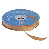 a spool of tan colored cloth tape on a white background with the words,