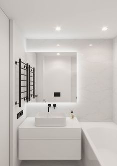 a bathroom with white walls and flooring has a bathtub, sink, and mirror