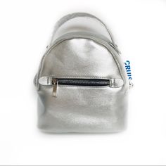 Soft Zip Around Mini With Top Carry Handle Backpack Straps ( Adjustable) Front Zip Pocket Soft With Structure Measurements: Length: 8” Width: 3.5” Height: 7” Handle Drop: 2 “ Metallic Shoulder Bag With Silver-tone Hardware For Travel, High-end Silver Bag With Detachable Strap, Silver Backpack With Zipper Closure, On-the-go Backpack With Gunmetal Hardware, Luxury Leather Backpack With Silver-tone Hardware, Black Mini Bag, Black Evening Bag, Soft Leather Handbags, Brown Crossbody Bag