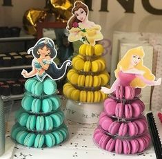 there are three princess macaroons on the table