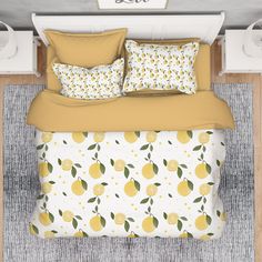 a bed with lemons and leaves on it