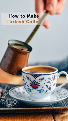 someone is pouring coffee into a cup on a plate with the words how to make turkish coffee