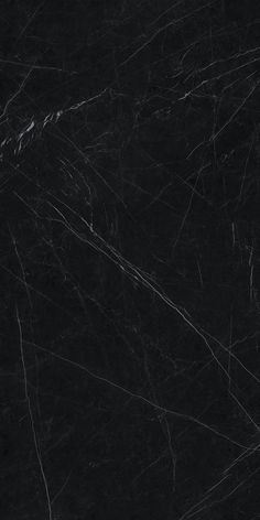 black marble textured with white lines and streaks on it's surface, as well as the edges